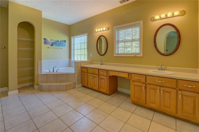 172 Lakeview Dr, Newborn, GA 30056 - full bath featuring double vanity, a bath, tile patterned flooring, and a textured ceiling