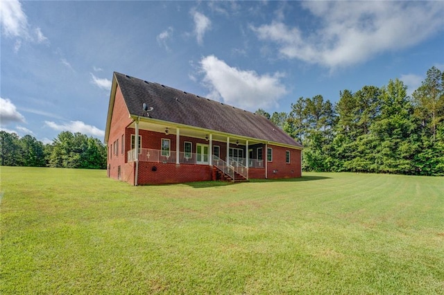 172 Lakeview Dr, Newborn, GA 30056 - rear view of house with a yard, ceiling fan, and brick siding
