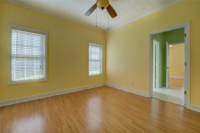 172 Lakeview Dr, Newborn, GA 30056 - empty room with ornamental molding, ceiling fan, and light wood finished floors