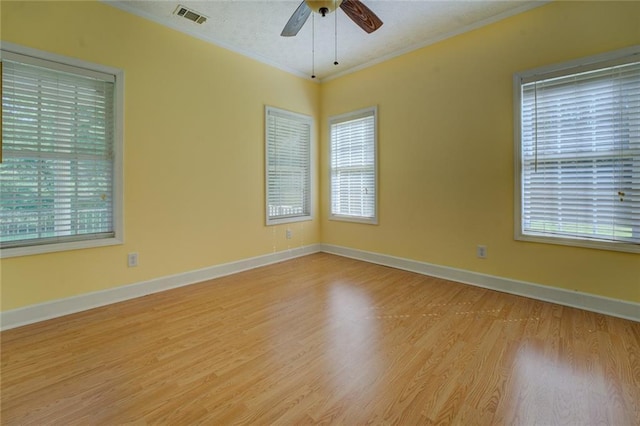 172 Lakeview Dr, Newborn, GA 30056 - empty room with ornamental molding, ceiling fan, and light wood finished floors