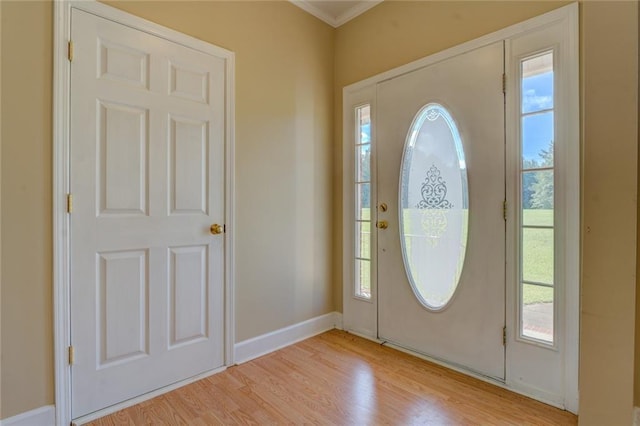 172 Lakeview Dr, Newborn, GA 30056 - foyer with light wood-style floors and ornamental molding