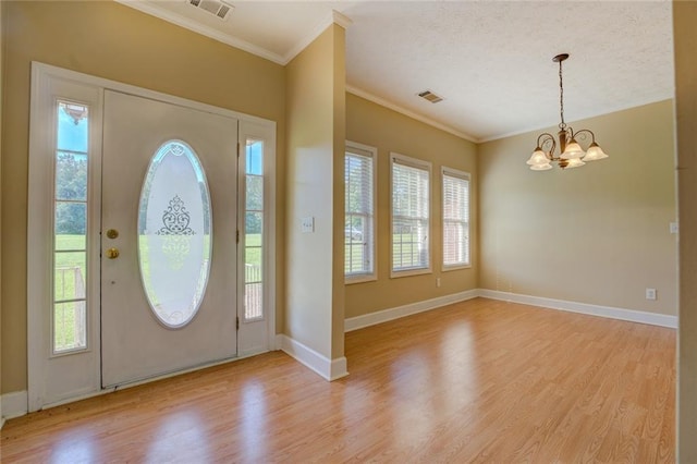 172 Lakeview Dr, Newborn, GA 30056 - foyer with crown molding, light wood finished floors, and a chandelier