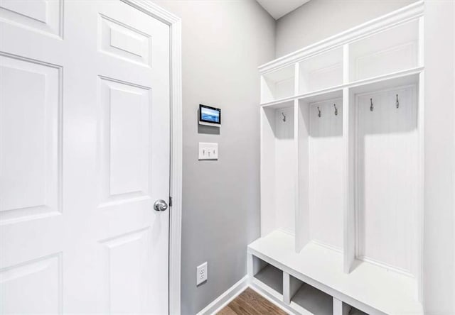 mudroom with baseboards and wood finished floors