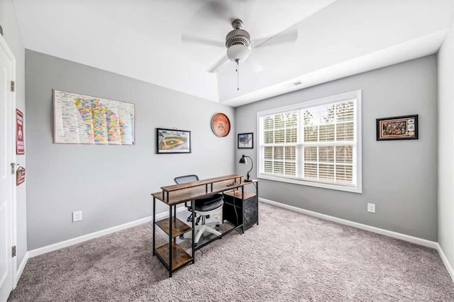 home office with carpet, baseboards, and a ceiling fan