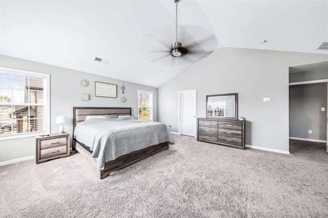 carpeted bedroom featuring lofted ceiling, visible vents, ceiling fan, and baseboards