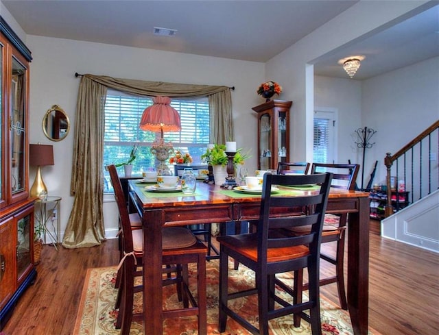 dining room with hardwood / wood-style floors