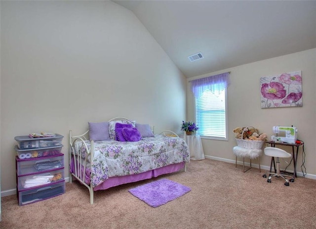 carpeted bedroom with lofted ceiling