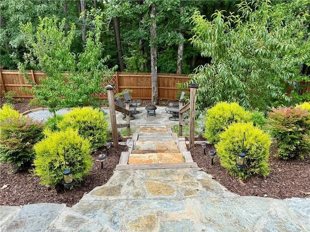 view of yard with a patio area and a fire pit