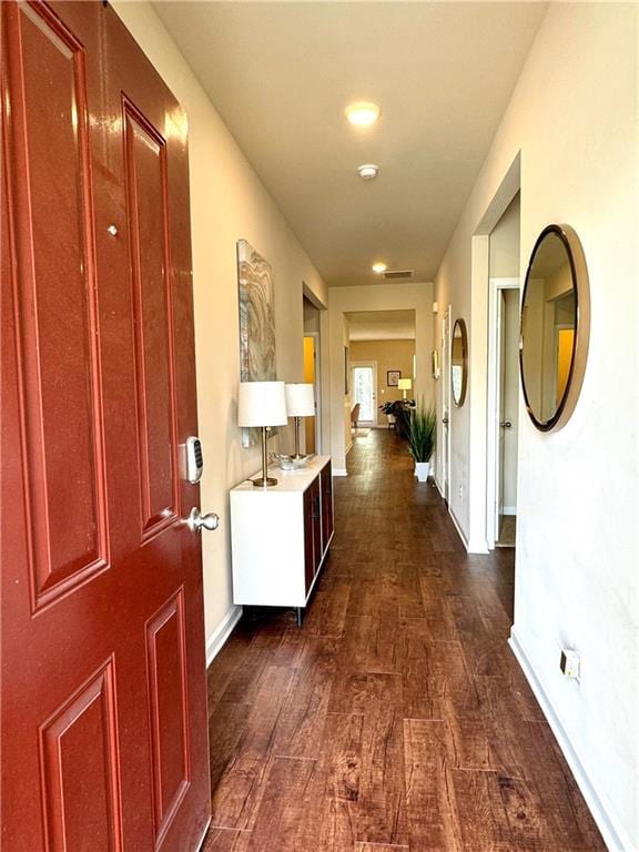 hall with dark wood-type flooring