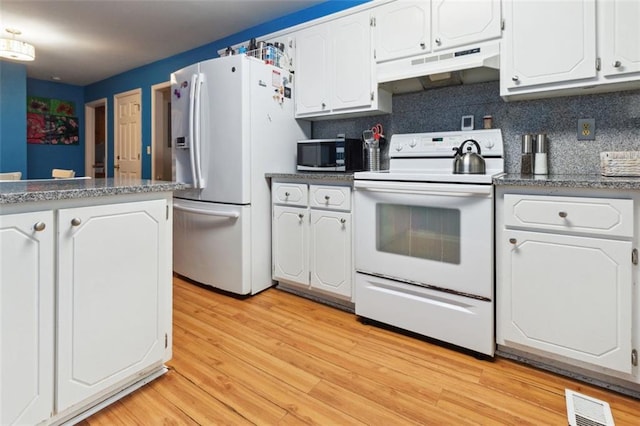 141 Mills Creek Path, Hiram, GA 30141 - kitchen with white appliances, under cabinet range hood, white cabinetry, and light wood-type flooring