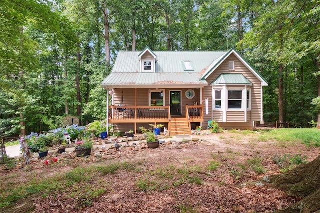 141 Mills Creek Path, Hiram, GA 30141 - view of front facade with a porch, metal roof, and view of scattered trees