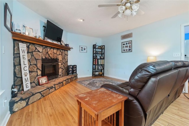 141 Mills Creek Path, Hiram, GA 30141 - living area with ceiling fan, wood finished floors, baseboards, and a fireplace
