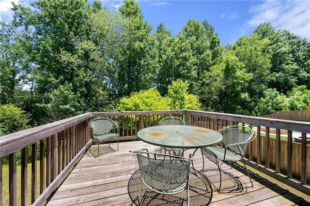 wooden terrace featuring outdoor dining space