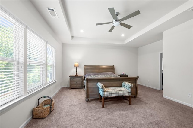 bedroom featuring a raised ceiling, carpet, recessed lighting, baseboards, and visible vents