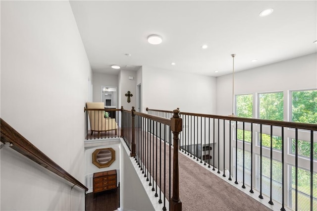 stairs with recessed lighting and carpet