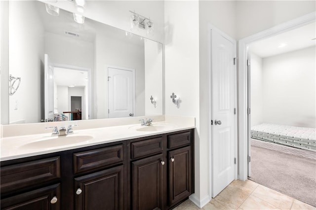 full bathroom featuring double vanity, a sink, tile patterned flooring, and visible vents