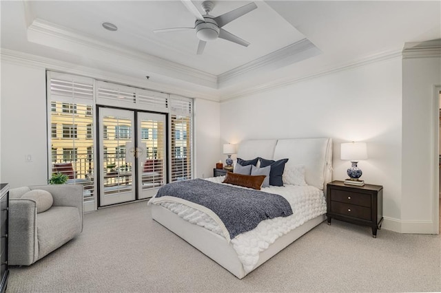 bedroom featuring ornamental molding, baseboards, access to outside, light colored carpet, and a raised ceiling