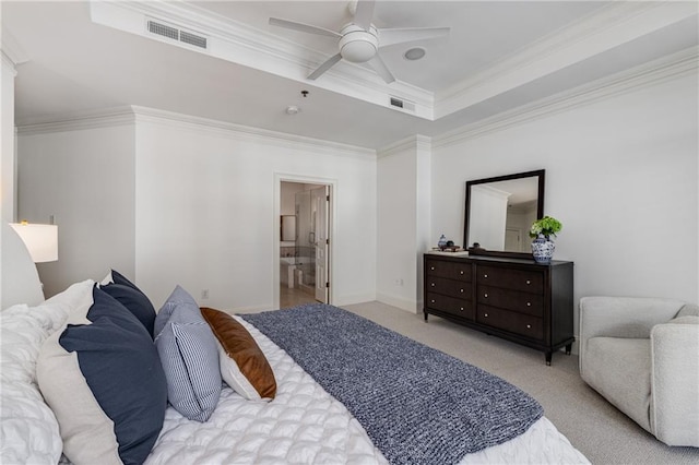 bedroom with visible vents, ornamental molding, carpet, and a tray ceiling