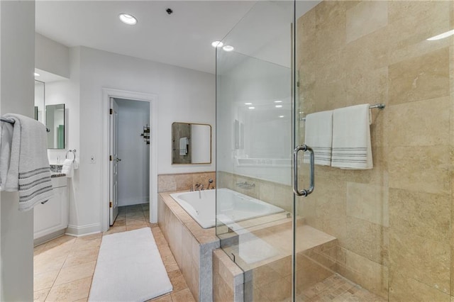 bathroom with a garden tub, baseboards, recessed lighting, tile patterned floors, and a shower stall