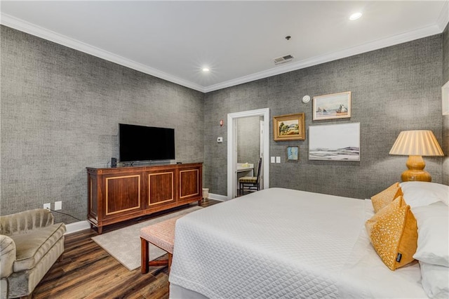 bedroom with ornamental molding, recessed lighting, wood finished floors, and visible vents