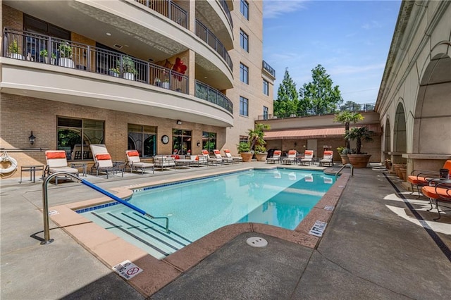 community pool with a patio