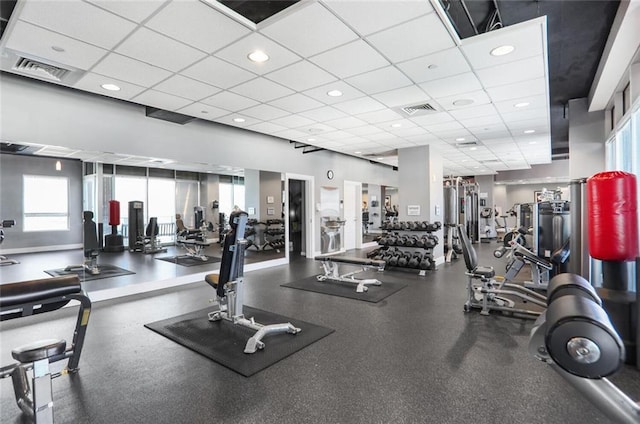 workout area with visible vents, recessed lighting, and a paneled ceiling