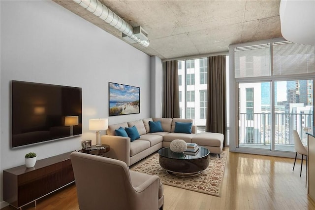 living room featuring plenty of natural light and hardwood / wood-style floors