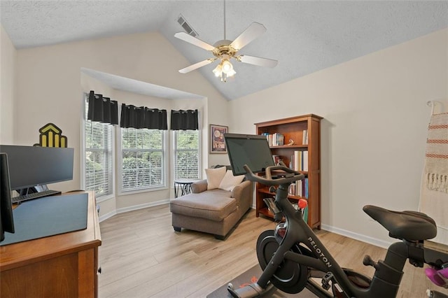 1865 Morgans Run Trl, Buford, GA 30519 - workout room featuring light wood finished floors, ceiling fan, a textured ceiling, baseboards, and high vaulted ceiling