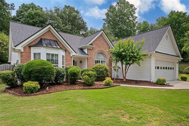 1865 Morgans Run Trl, Buford, GA 30519 - view of front facade with roof with shingles, driveway, brick siding, and a front lawn