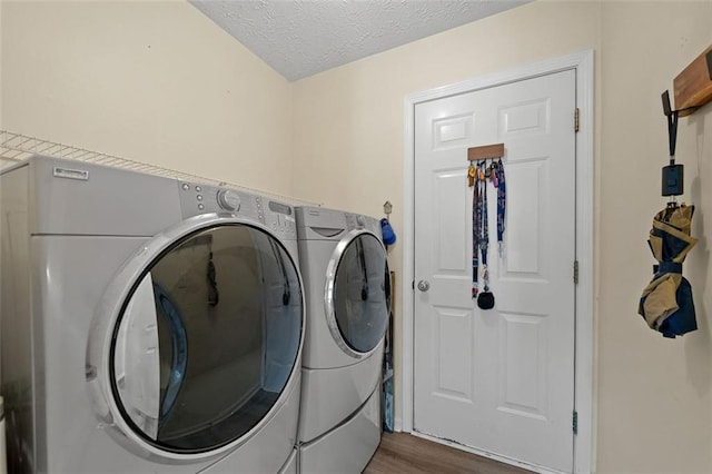 1865 Morgans Run Trl, Buford, GA 30519 - laundry area with separate washer and dryer, wood finished floors, and a textured ceiling