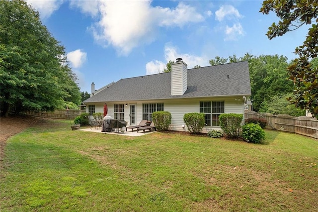 1865 Morgans Run Trl, Buford, GA 30519 - rear view of house featuring a patio area, a shingled roof, and a chimney