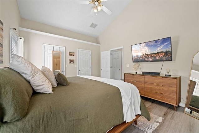 1865 Morgans Run Trl, Buford, GA 30519 - bedroom featuring light wood-style flooring, high vaulted ceiling, and ceiling fan