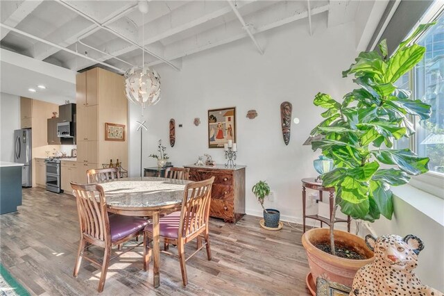 dining area with light hardwood / wood-style floors