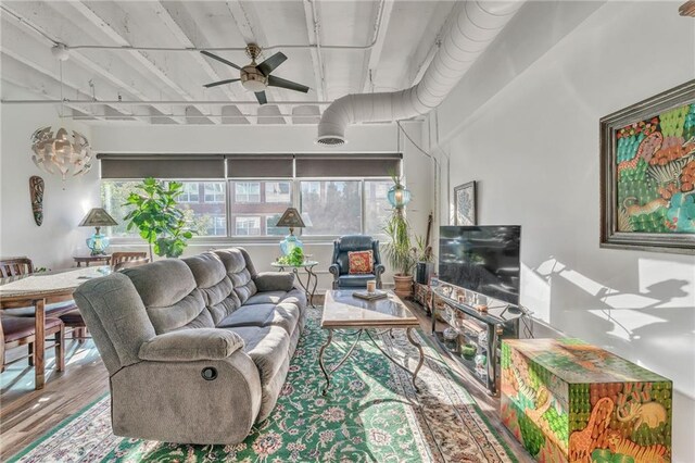 living room with hardwood / wood-style floors and ceiling fan