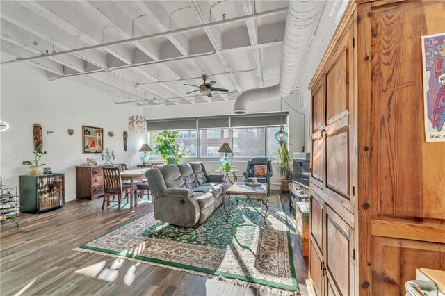 living room featuring ceiling fan and wood-type flooring