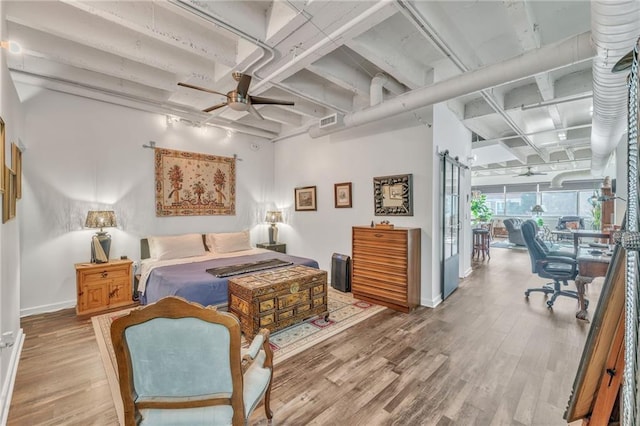 bedroom featuring hardwood / wood-style flooring and ceiling fan