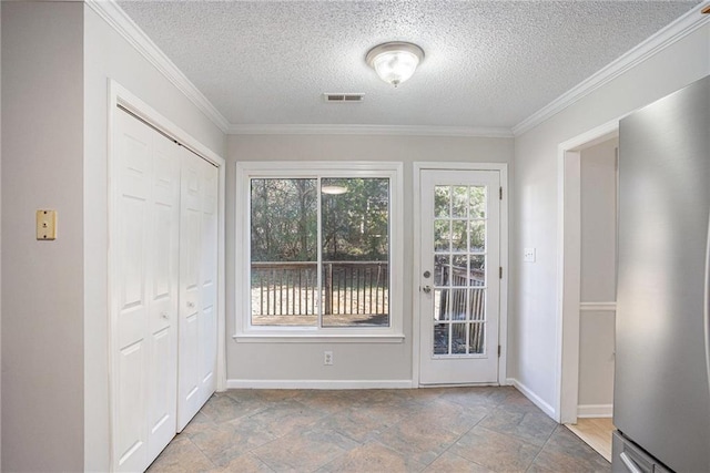 doorway to outside with a textured ceiling and ornamental molding