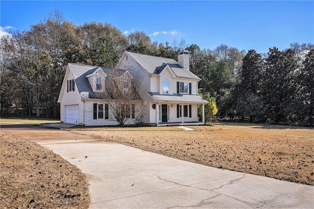 view of front of house featuring covered porch and a garage