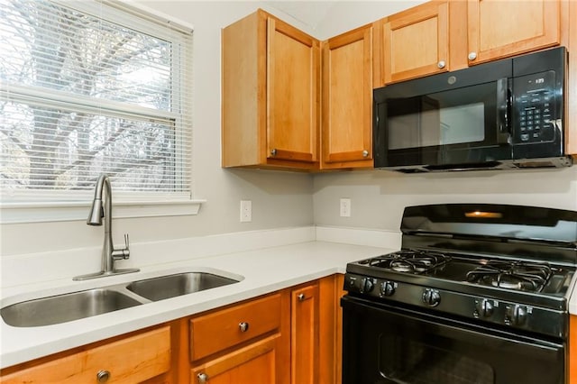 kitchen featuring sink and black appliances