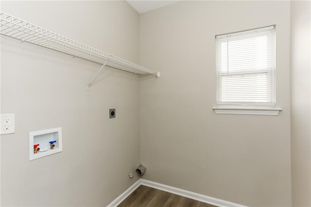 clothes washing area featuring hookup for an electric dryer, dark wood-type flooring, washer hookup, and a healthy amount of sunlight