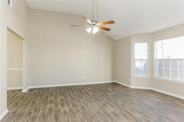 unfurnished room with ceiling fan, dark wood-type flooring, and vaulted ceiling