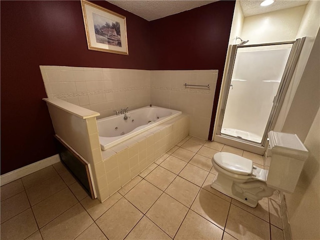 5026 Limerick Ln, Flowery Branch, GA 30542 - bathroom featuring a whirlpool tub, a textured ceiling, a stall shower, and tile patterned flooring