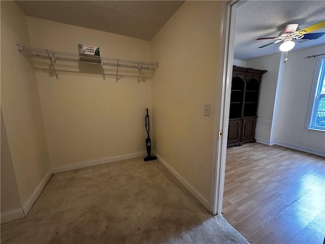 5026 Limerick Ln, Flowery Branch, GA 30542 - laundry area featuring a textured ceiling, a ceiling fan, and light wood-style flooring