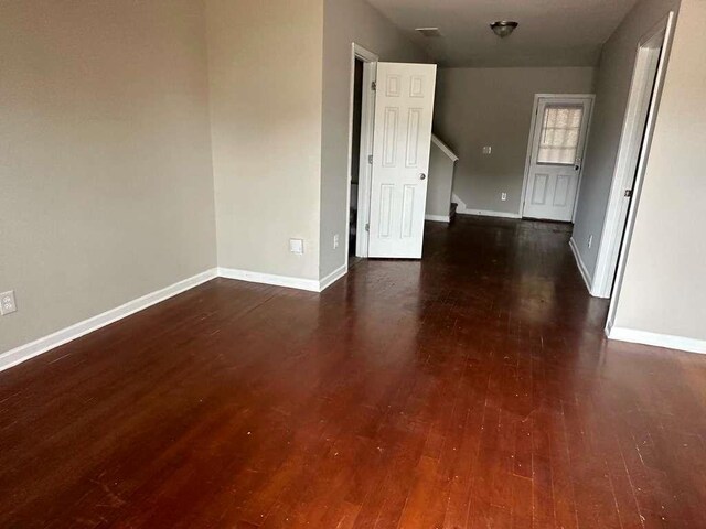 spare room featuring dark hardwood / wood-style floors