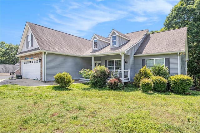 208 Stonington Dr, Mount Airy, GA 30563 - new england style home featuring covered porch, a front lawn, a shingled roof, and asphalt driveway