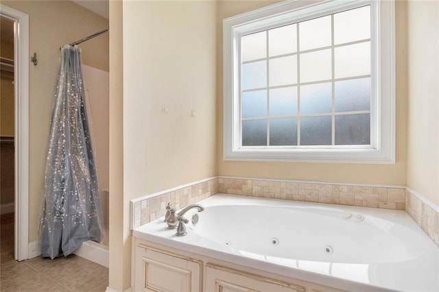 208 Stonington Dr, Mount Airy, GA 30563 - bathroom featuring healthy amount of natural light, curtained shower, a tub with jets, and tile patterned floors