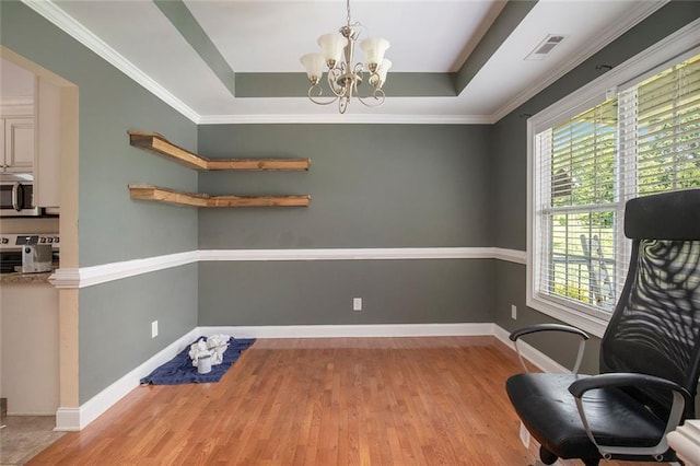 208 Stonington Dr, Mount Airy, GA 30563 - office space featuring wood finished floors, a tray ceiling, a chandelier, and baseboards