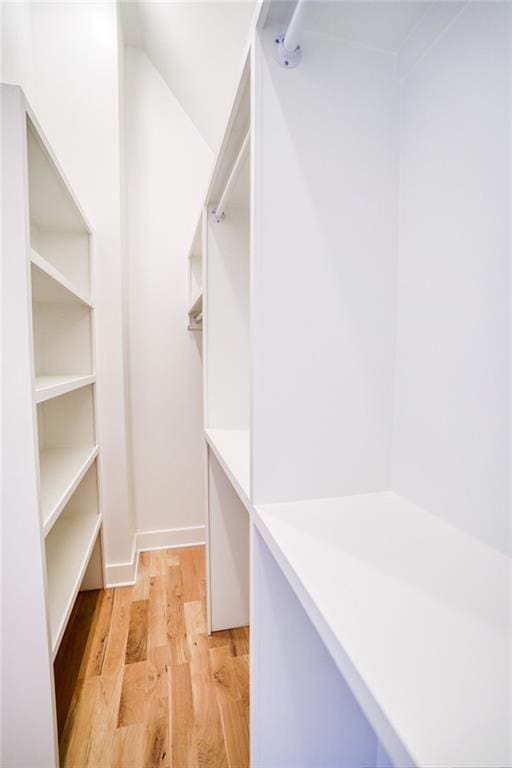 walk in closet featuring light wood-type flooring