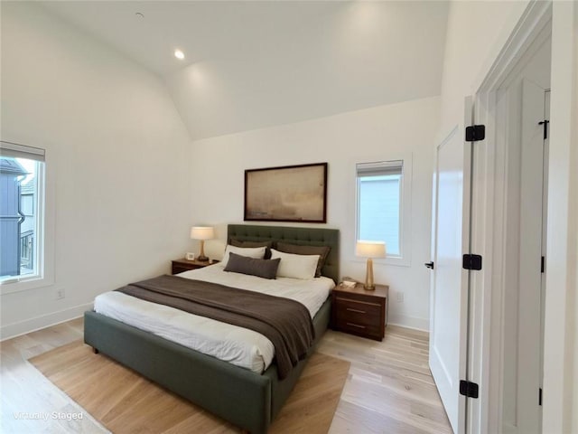 bedroom featuring recessed lighting, light wood-style floors, baseboards, and high vaulted ceiling