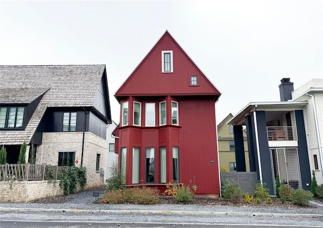 view of front of house featuring fence